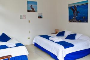 Voodi või voodid majutusasutuse Gran Hostal Tintorera toas