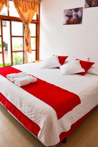 Voodi või voodid majutusasutuse Gran Hostal Tintorera toas