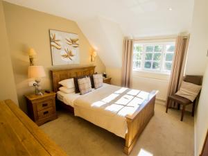 a bedroom with a large bed and a window at Sheene Mill in Melbourn +44 photos