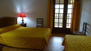 Кровать или кровати в номере Auberge de la Fadaise