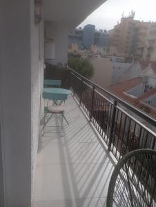 a balcony with a table and chairs on it at Maestro Concepcion Guidet in Fuengirola