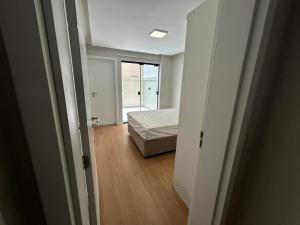 Cama o camas de una habitación en Apartamento Balneário