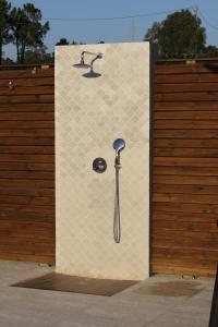 a wall with a picture of a toothbrush on it at Zambujal Suites in Sesimbra