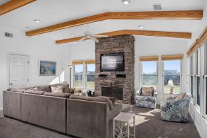 a living room with a couch and a fireplace at B20 Bay Meadow 20 in Nags Head