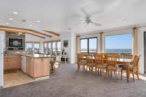 a kitchen and dining room with a table and chairs at B20 Bay Meadow 20 in Nags Head