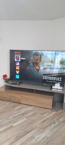 a large flat screen tv sitting on top of a table at Le Cent Onze in Gatineau