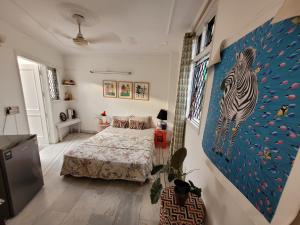 a bedroom with a bed and a painting of a zebra at Nice Bedroom with Private Ensuite Bathroom in New Delhi