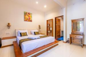 Postel nebo postele na pokoji v ubytování Paradise Villa Gili Air