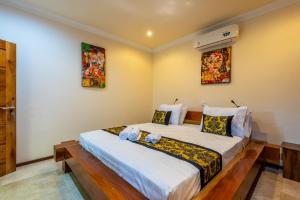 Postel nebo postele na pokoji v ubytování Paradise Villa Gili Air