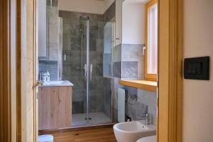 a bathroom with a shower and a sink at Piano terra vista lago in Auronzo di Cadore