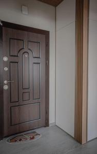 a door in a room with a rug in front of it at Central Apartment in Varna in Varna City