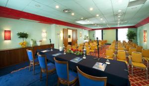 a conference room with tables and chairs in it at Castagna Palace Hotel & Restaurant in Montecchio Maggiore