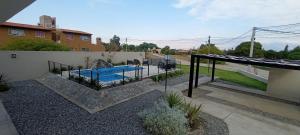 a swimming pool in the backyard of a house at Colores De La Quebrada in Cafayate