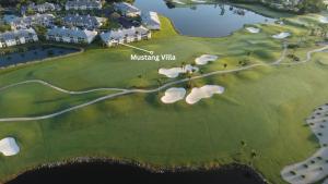 a rendering of a golf course with the missing villa at GreenLinks Golf View Villa Mustang at Lely Resort in Naples