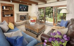 a living room with couches and a fireplace at Timberline Condominiums 2 Bedroom Premier Unit C1D in Snowmass Village