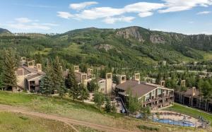 an aerial view of a resort with mountains in the background at Timberline Condominiums 2 Bedroom Premier Unit C1D in Snowmass Village