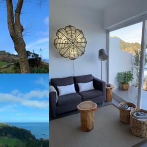 a living room with a couch and a tree at Casa Da Praia in Porto Formoso