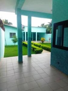 a view of a building with blue columns at Appartement en location in Lomé