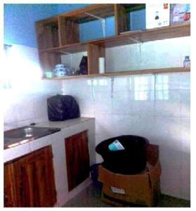 a kitchen with a counter and some boxes at Appartement en location in Lomé