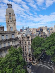 a tall building with a clock tower in a city at Pampa, Mayo home in Buenos Aires