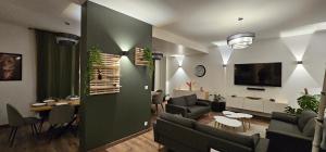 TV a/nebo společenská místnost v ubytování Le Clos Maldier - Gîte de la Belle vue