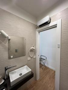 a bathroom with a sink and a mirror at Casa Imperatore in Naples