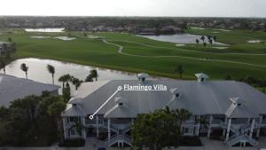 an aerial view of a building with a golf course at GreenLinks Golf View Villa Flamingo at Lely Resort in Naples
