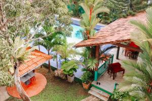 an aerial view of a house with a swimming pool at Damith Guest House in Unawatuna