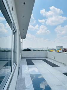 a balcony of a building with a view of the city at Hotel ksp kings inn in Bangalore