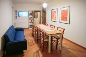 a living room with a dining room table and chairs at RossoToscano in Piantravigne +17 photos
