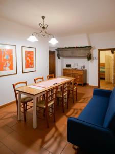 a kitchen and dining room with a table and chairs at RossoToscano 