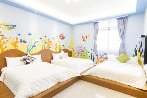 Ένα ή περισσότερα κρεβάτια σε δωμάτιο στο Mu Yu B&B