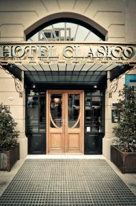 
a large building with a large clock on the front of it at Hotel Clasico in Buenos Aires
