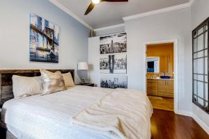 a bedroom with a large bed and a bathroom at Desert Cottage in Fountain Hills +21 photos