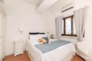 Posteľ alebo postele v izbe v ubytovaní Poggio Imperiale House(Porta Romana)