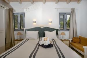 Postel nebo postele na pokoji v ubytování Villa Marmari