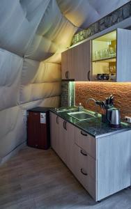 a kitchen with a sink in a tent at Daxvalley Glamping in Tsalka