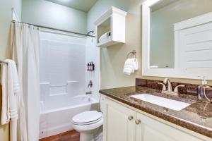 a bathroom with a sink and a toilet and a tub at Centrally Located Abilene Home Near ACU and Downtown in Abilene +21 photos