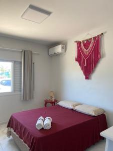 Säng eller sängar i ett rum på Recanto aconchegante no Campeche Apart 02 - 50m da praia -
