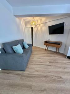 A television and/or entertainment centre at Outside Corner - Lavalle Apartamentos