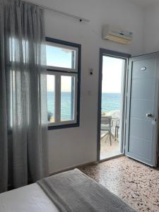 Posteľ alebo postele v izbe v ubytovaní Chrisopetro Rooms
