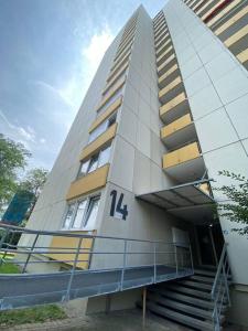 a building with the number on the side of it at Stylish flat close to Basel with a stunning view in Weil am Rhein +5 photos