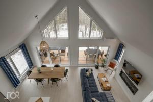 an overhead view of a living room with a large window at Villa Scandinave 3 CAC avec 3 SDB privées & SPA in Pont-Rouge