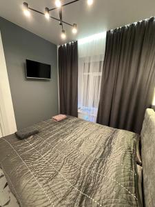 Ένα ή περισσότερα κρεβάτια σε δωμάτιο στο Apartment on Snijna street 5