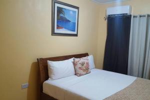 Ein Bett oder Betten in einem Zimmer der Unterkunft Tropical Home Oasis