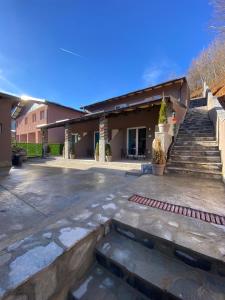 a building with stairs in front of it at Blue Lagoon Apartments in Crni Vrh