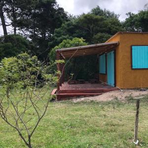 a house with a cover on the outside of it at La casita de Valizas in Barra de Valizas
