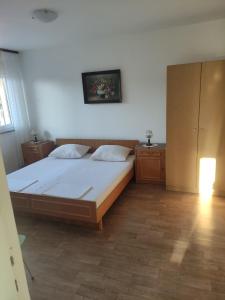 Postel nebo postele na pokoji v ubytování Dragiv 2