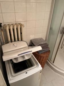 a kitchen with a toaster oven and a radiator at TENNIS LIFE ŠUMPERK in Šumperk