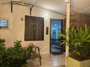 a room with potted plants and a door at Apartaestudios norte de barranquilla in Barranquilla